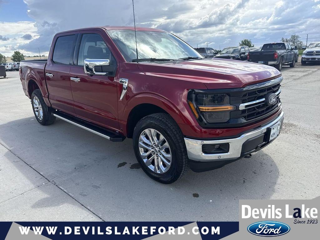2026 Ford F-150 XLT in Ruby Red Metallic Tinted Clearcoat — front three-quarter view