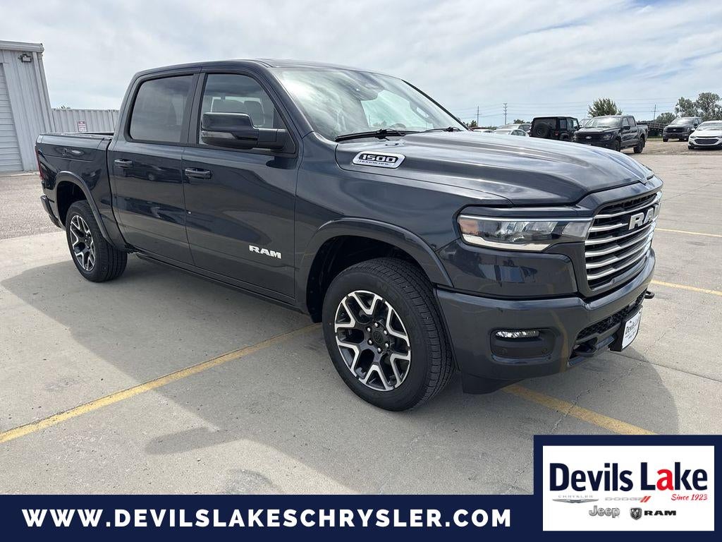 2026 RAM Ram 1500 RAM 1500 LARAMIE CREW CAB 4X4 5'7' BOX in Forged Blue Metallic — front three-quarter view
