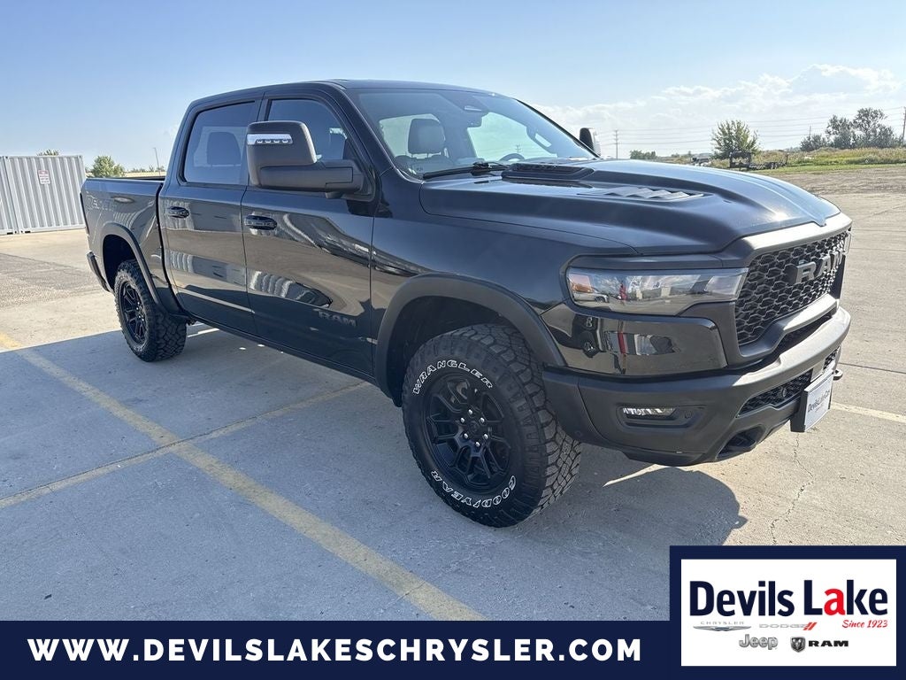 2025 RAM 1500 Rebel Crew Cab 4x4 5'7' Box in Diamond Black Crystal Pearlcoat — front three-quarter view