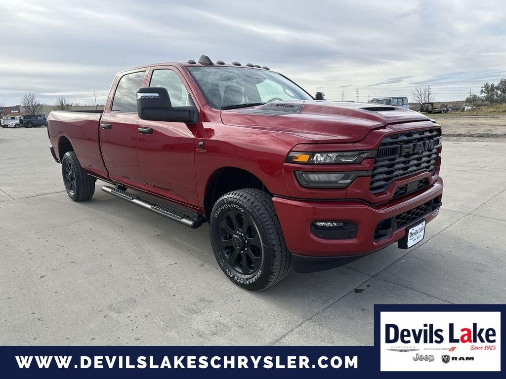 2026 RAM Ram 2500 RAM 2500 BLACK EXPRESS CREW CAB 4X4 8' BOX in Molten Red Pearlcoat — front three-quarter view