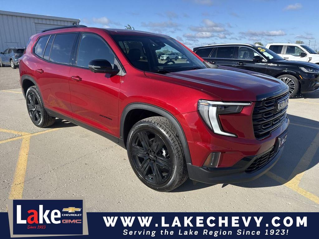 2026 GMC Acadia Elevation in Volcanic Red Tintcoat — front three-quarter view