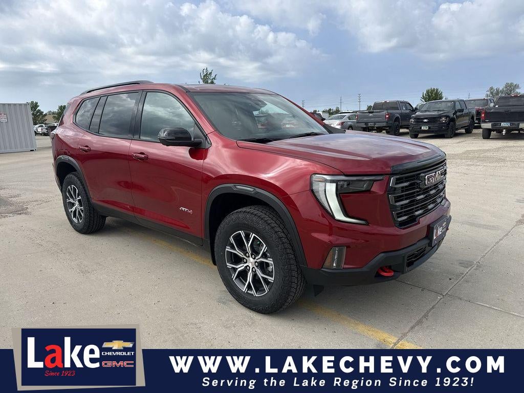 2026 GMC Acadia AT4 in Volcanic Red Tintcoat — front three-quarter view